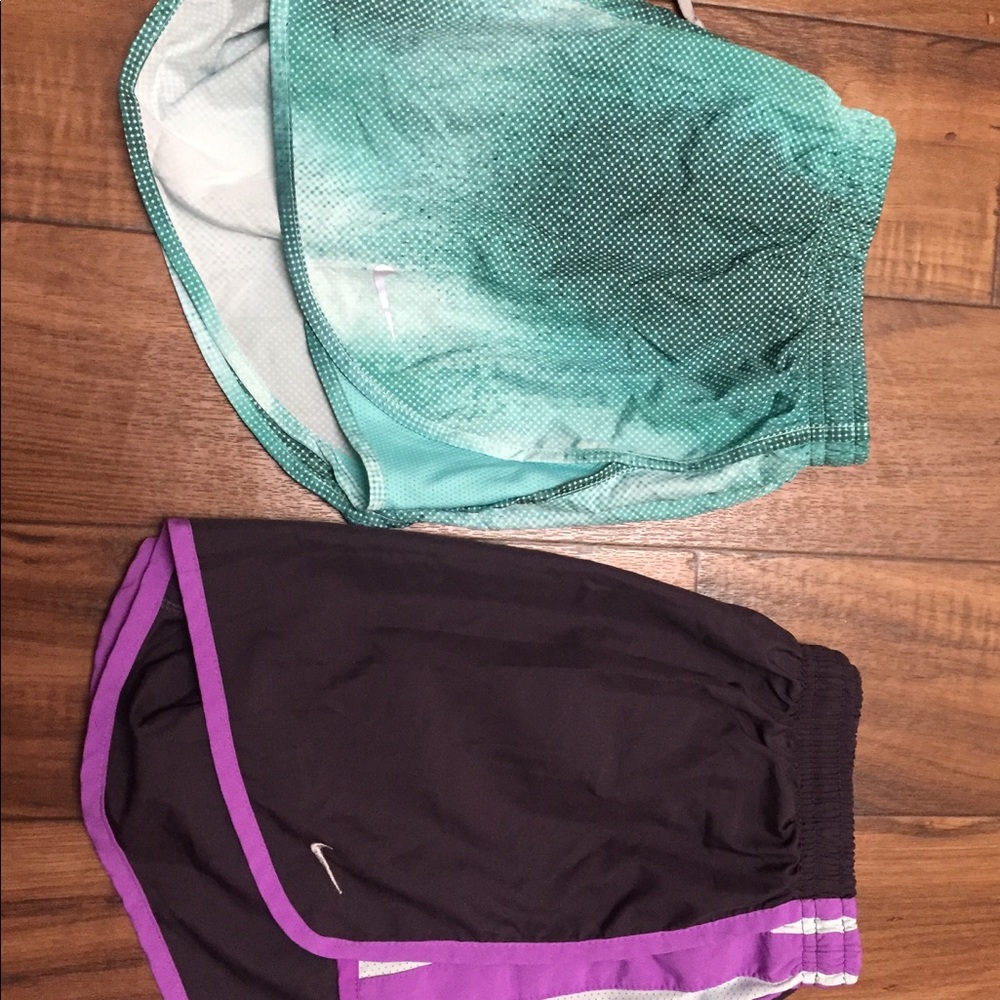 Nike running shorts. Purple and green/blue